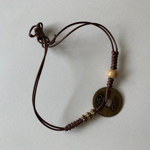 # NWOT Beaded Chinese String Bracelet